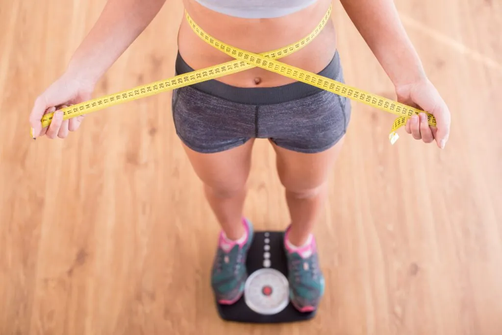 woman scale tape measure